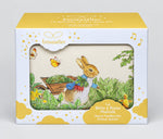 Boîte à bijoux musicale Peter Rabbit dans son emballage Trousselier blanc et jaune, vue de face
