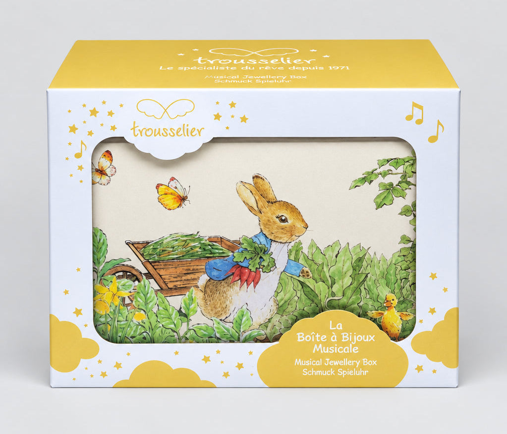 Boîte à bijoux musicale Peter Rabbit dans son emballage Trousselier blanc et jaune, vue de face